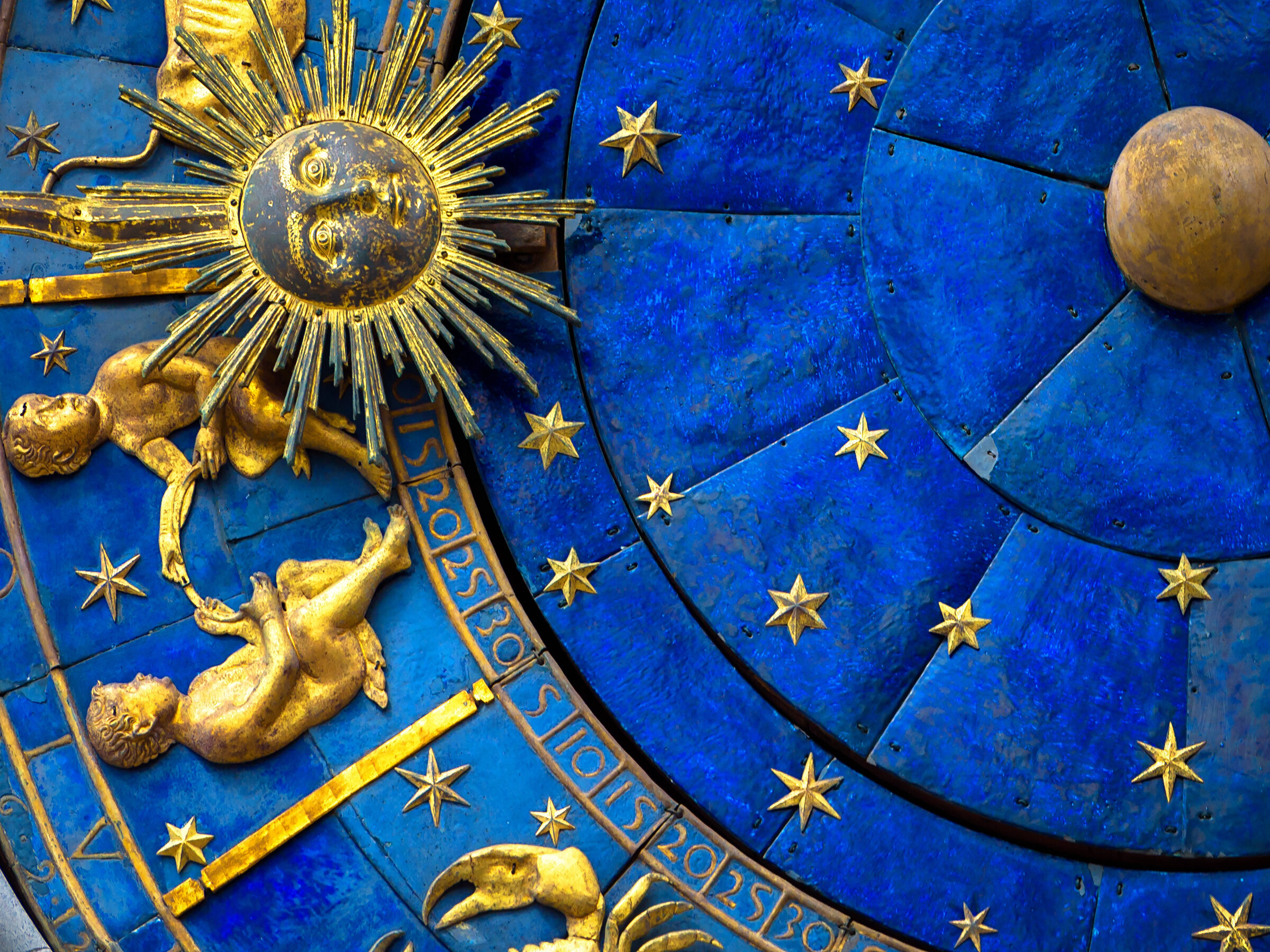 Gemini astrological sign on ancient clock. Detail of Zodiac whee